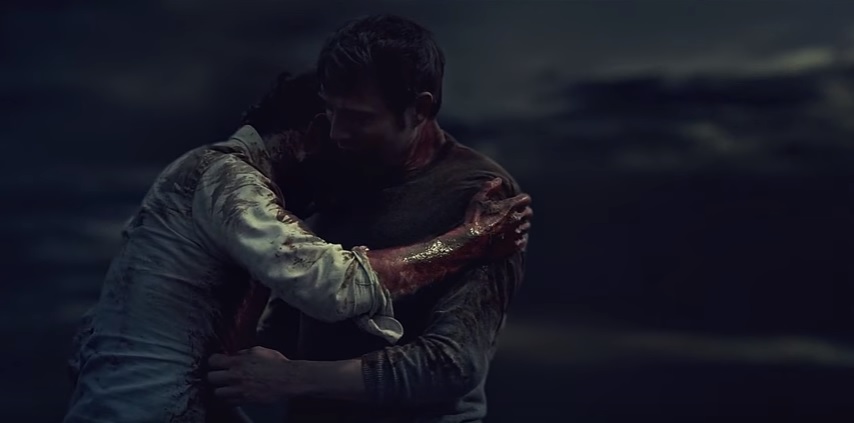 Screencap of Hannibal and Will's embrace on the cliff top in the 2015 series finale of Hannibal.