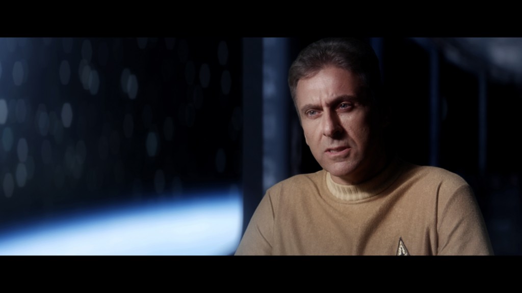 A still from Prelude to Anaxar, showing fan film creator Alec Peters in a tan Star Trek uniform.