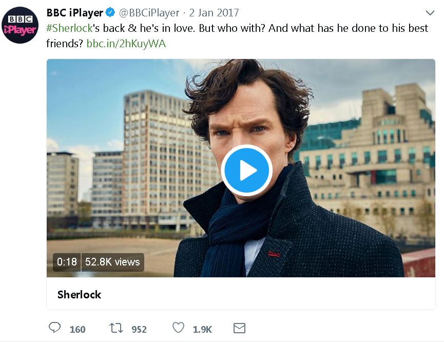 Screenshot of BBCiPlayer tweet dated January 2, 2017, with a color image of Holmes standing in a city, a blue 'play' icon in the center of the image. Text reads: '#Sherlock's back & he's in love. But who with? And what has he done to his best friends? bbc.in/2hKuyWA.'