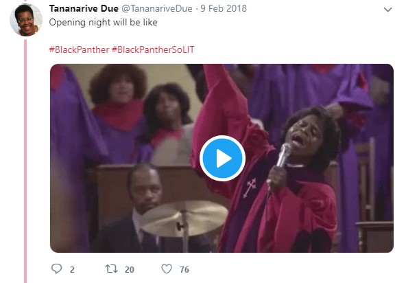 This tweet features a GIF clip from The Blues Brothers (1980), in which James Brown is performing in front of a church choir. He is a Black man singing in a bright pink and purple choir robe in front of a choir and musician.