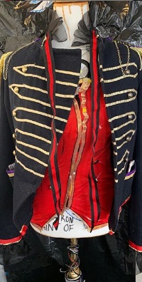 Mannequin wearing an open military-style jacket