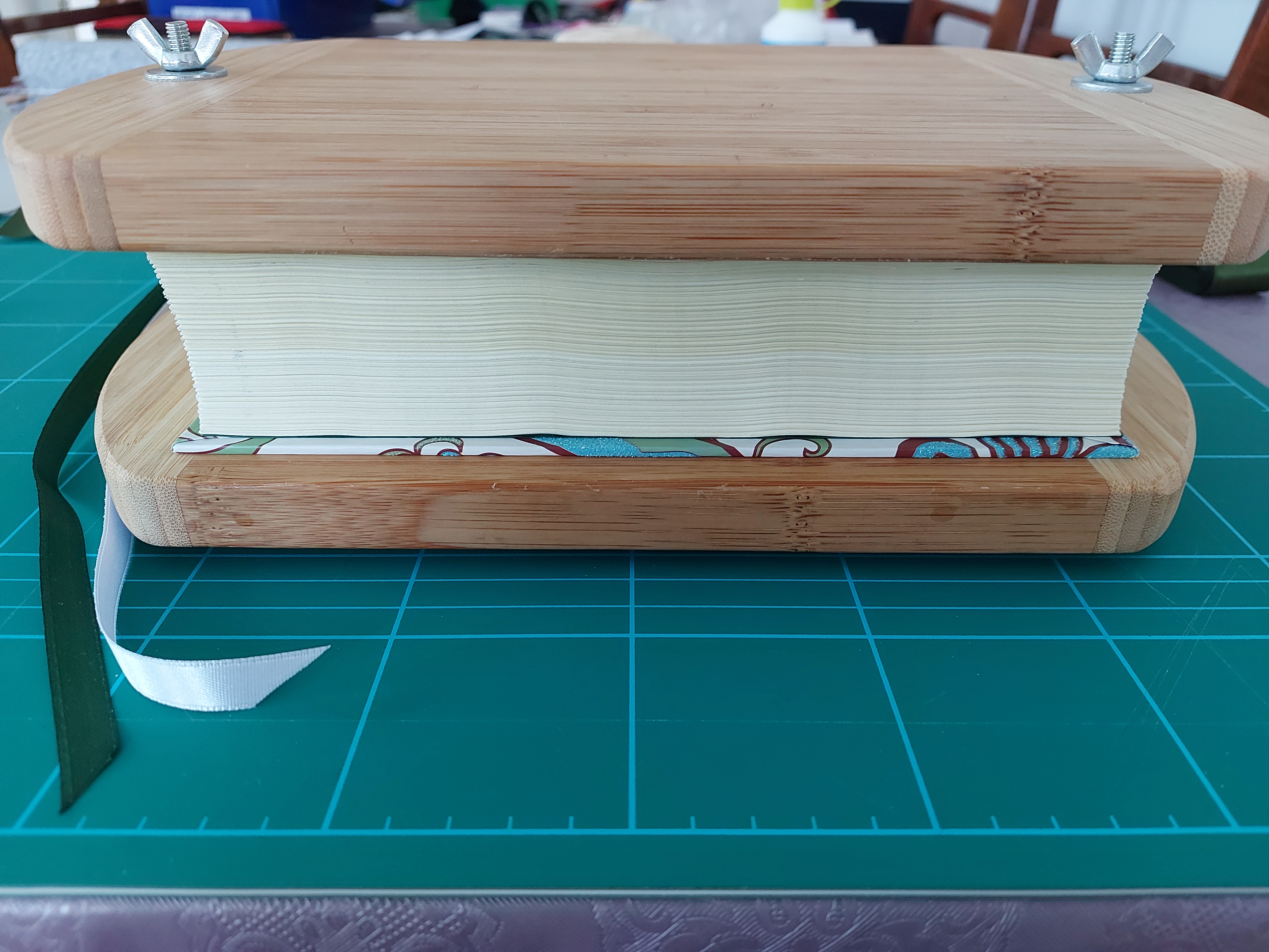 Hardcover book in a vise