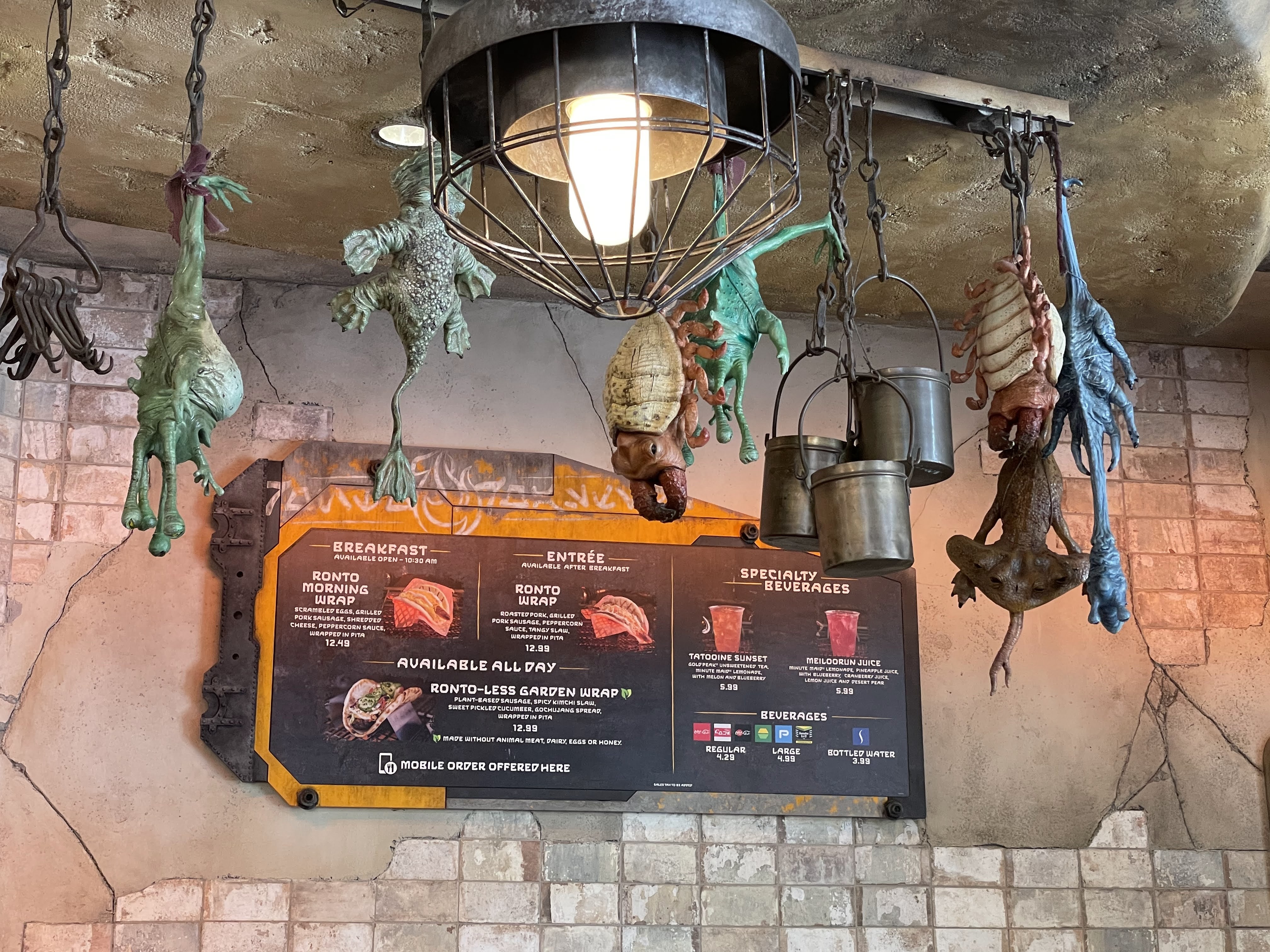 Plastic carcasses hang from the ceiling, as in a kitchen.