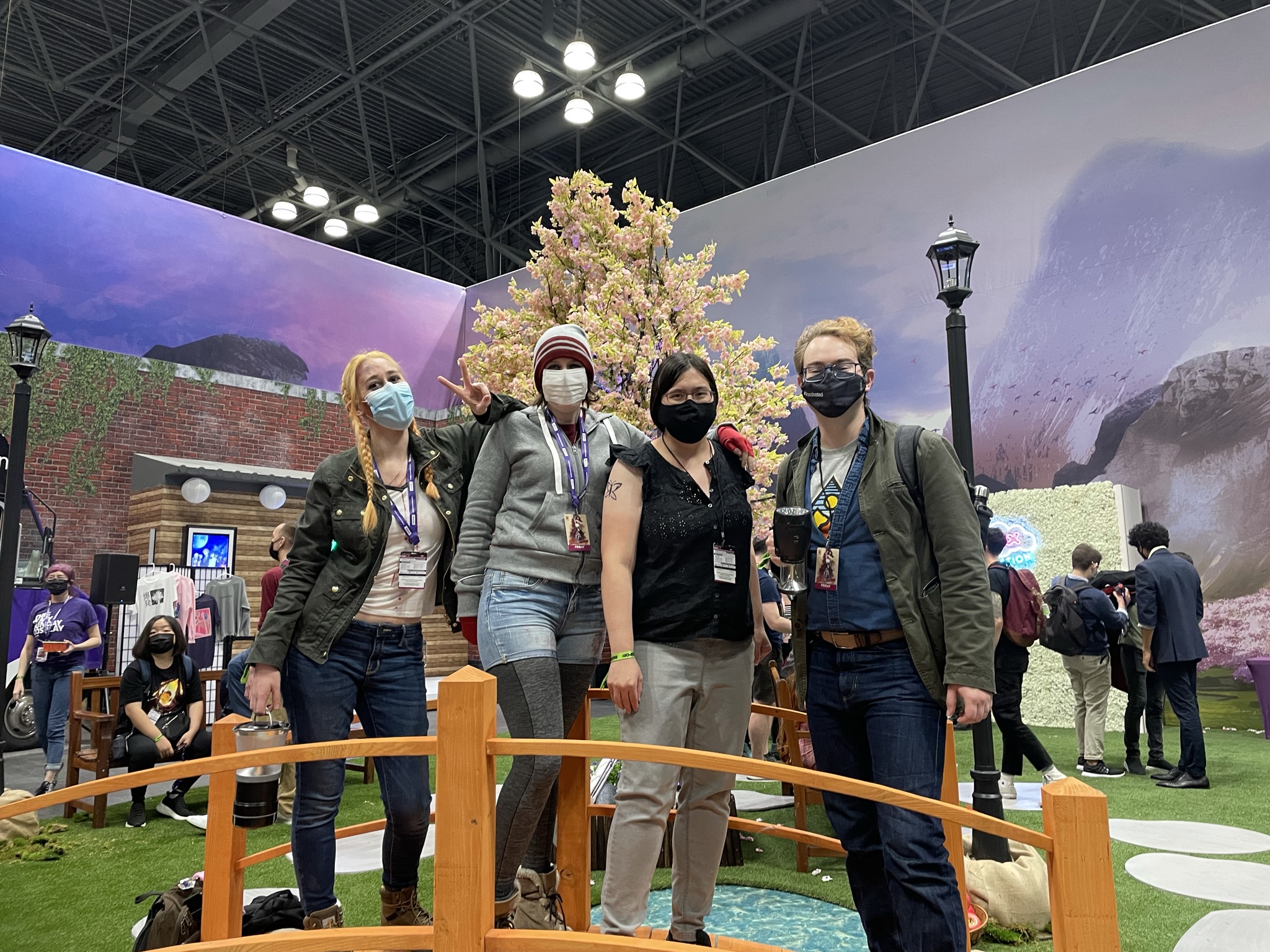 Sahara, Karis, Jason, and Lauren cosplay as a group visiting Japan at a New York Comic Con photo booth.