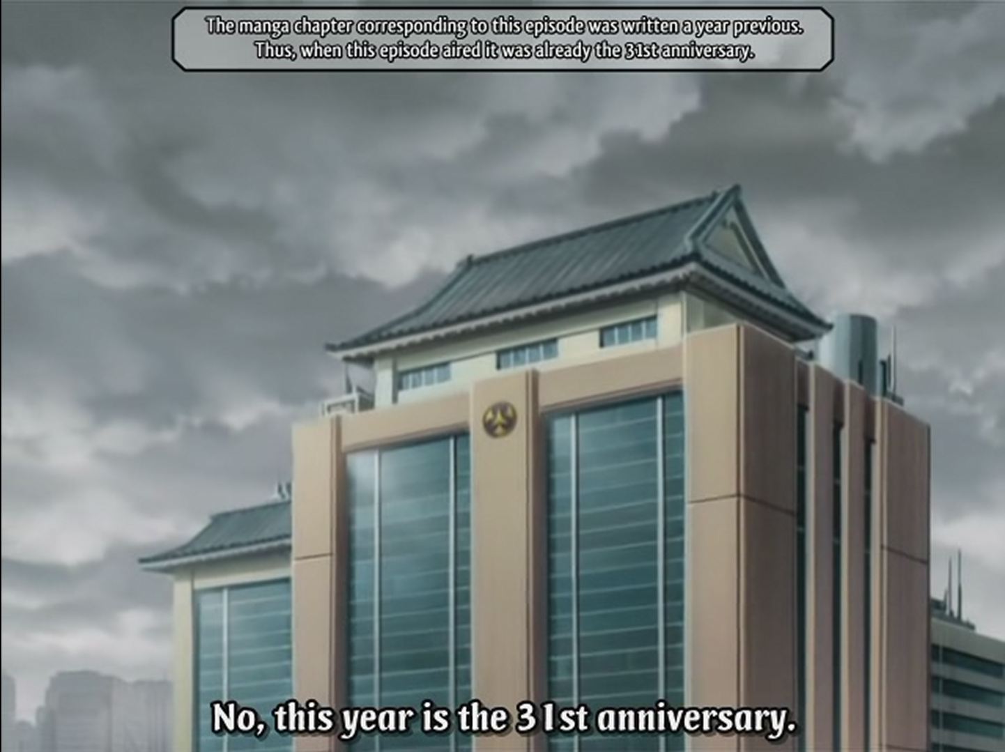 Screen cap of exterior of building. Supertitle: 'The manga chapter corresponding to this episode was written a year previous. Thus, when this episode aired it was already the 31st anniversary.' Subtitle: 'No, this year is the 31st anniversary.'