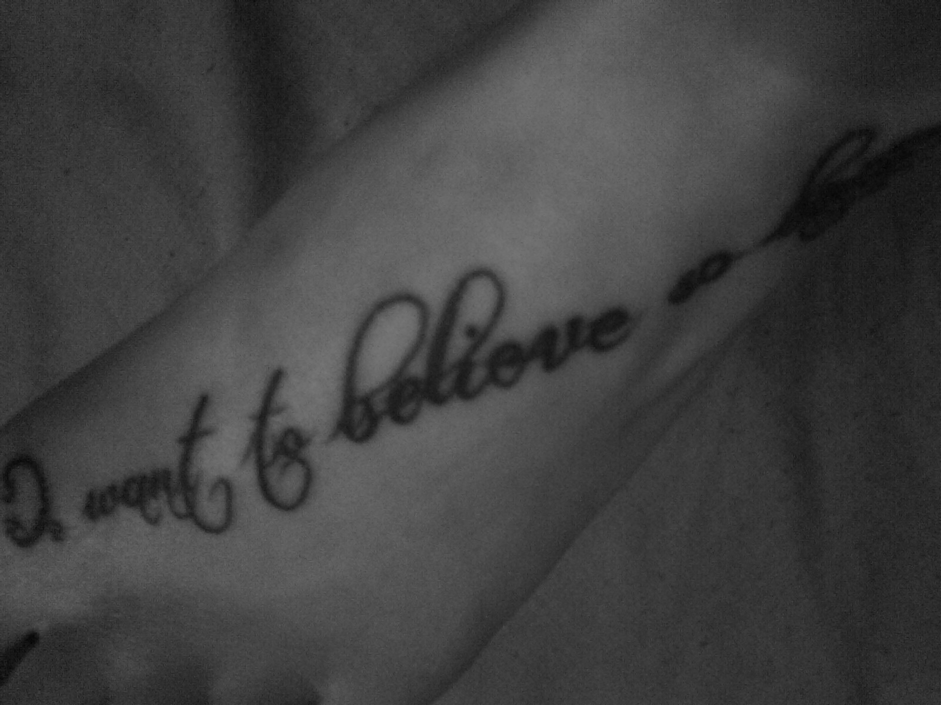 Foot tattoo beginning with 'I want to believe'.