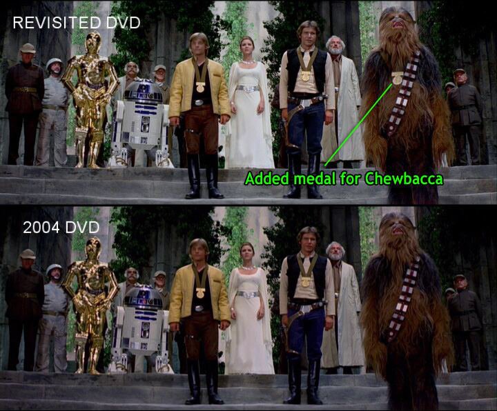  Split-screen image comparing two shots with Luke Skywalker, Han Solo, and Chewbacca standing before Princess Leia. Top image labeled REVISITED DVD. Bottom image labeled 2004 DVD. Chewbacca's medal indicated in top image (and not present in bottom image) with the following text: 'Added medal for Chewbacca.'